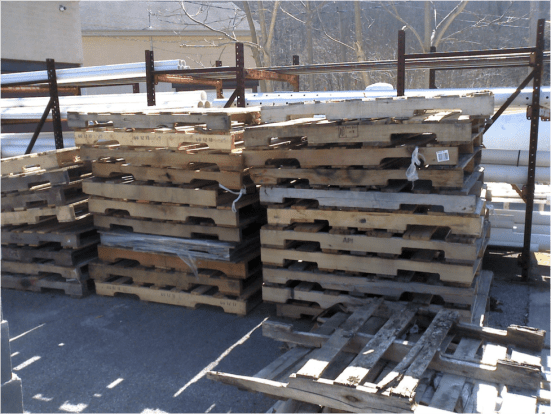 Used pallets behind the hardware store.